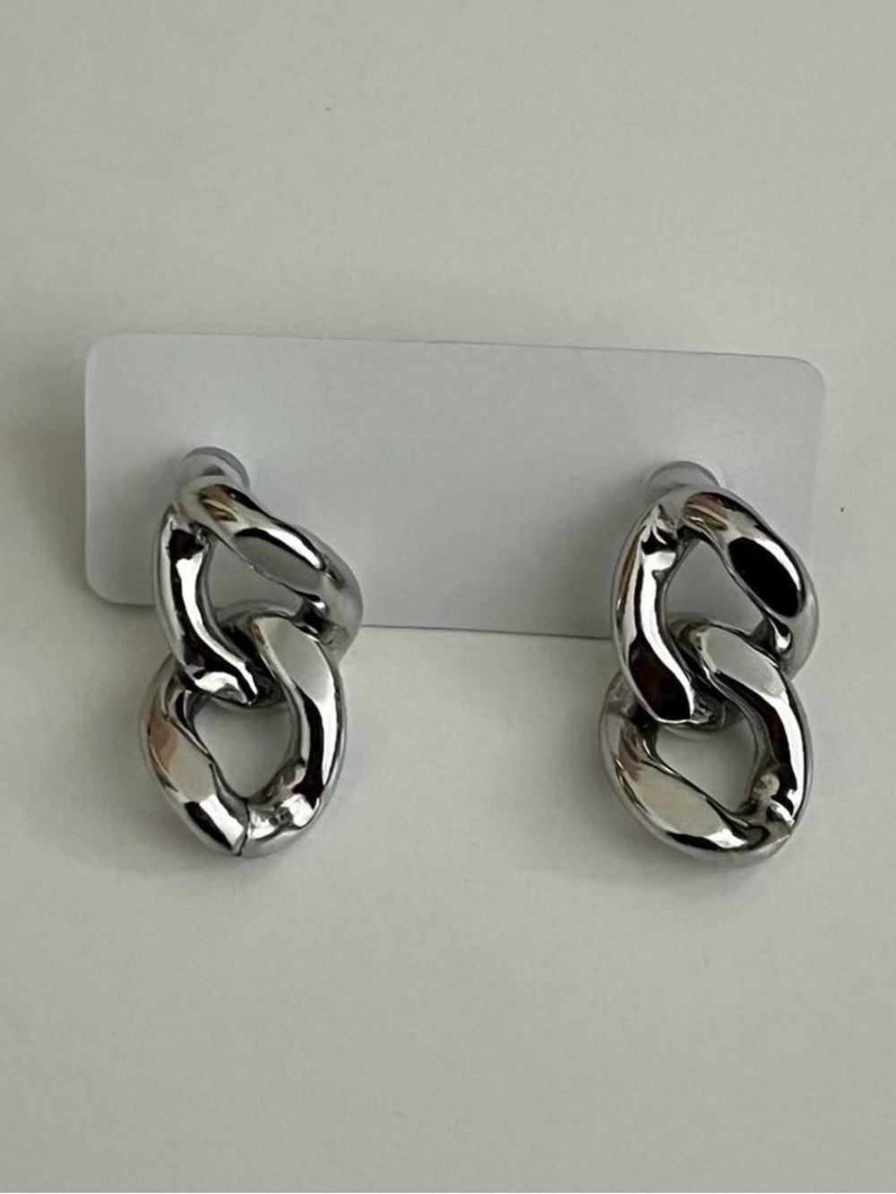 silver-coloured chain-link drop earrings